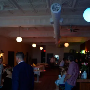 a group of people at a bar