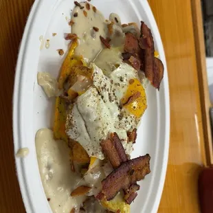 This is his &quot;knockout omelet&quot;   Fried biscuits, gravy, eggs, bacon
