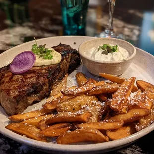 Steak &amp; Fries: aged black Angus NY strip steak topped w/ garlic herb butte &amp; fingerling fries, topped w/ cracked pepper &amp; duck fat salt