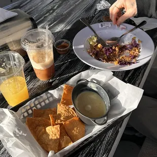 Fresh squeezed orange juice, dirty chai, chips and queso blanco, quinoa bowl
