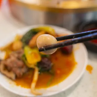 plate of food with chopsticks