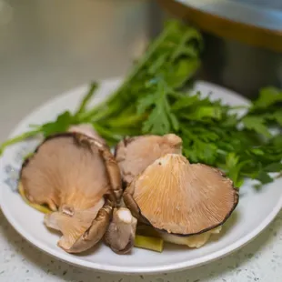 plate of mushrooms and broccoli