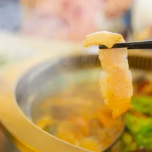 bowl of food with chopsticks