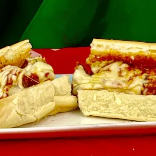 two sub sandwiches on a plate