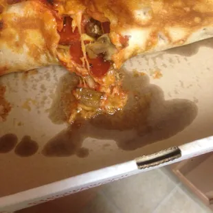 Undercooked stuck pizza