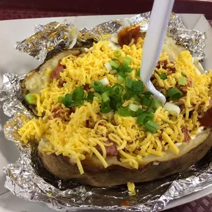 The stuffed baked potato with sausage