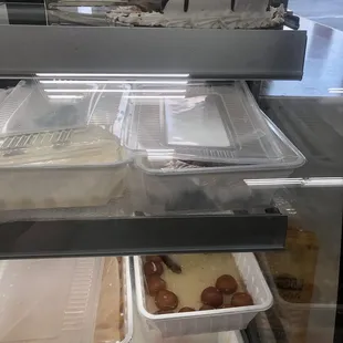 Cakes and fresh treats behind a deli styled glass case at the register that is a MUST to checkout!