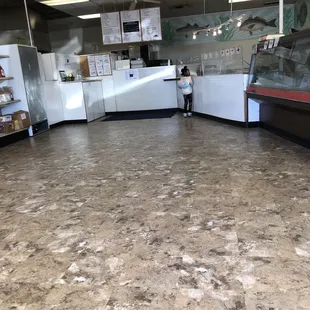 a woman standing in the middle of the counter