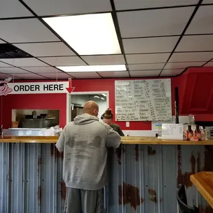a man standing at a counter