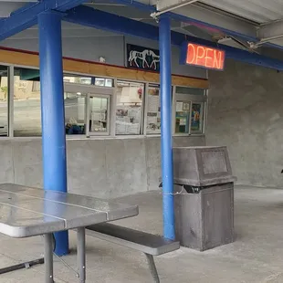 a parking lot with tables and benches