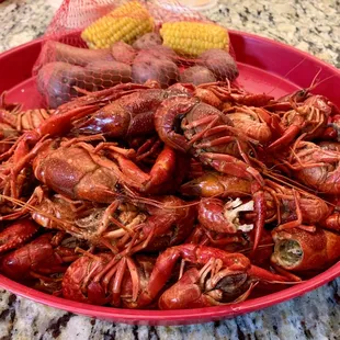 a bowl of craws and corn