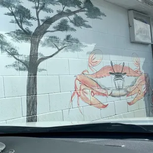 a crab painted on the side of a building