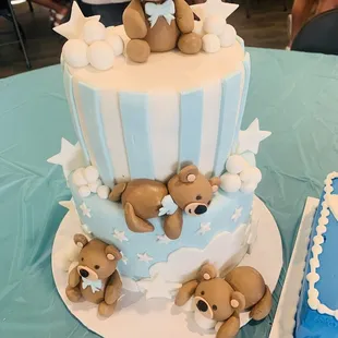 teddy bears on top of a cake