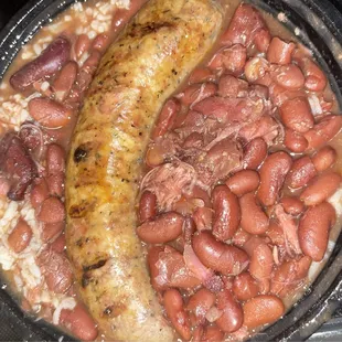 Smoked boudin with red beans and rice. So flavorful with a spicy heat to it. I got it to share and wish I'd gotten my own.