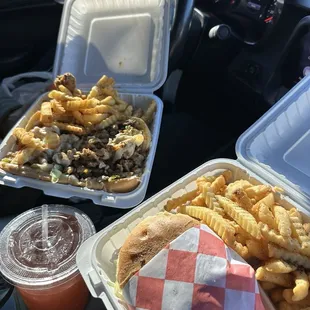 Cheeseburger with fries and cheese steak