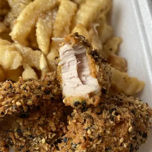 a close up of a chicken nuggs and macaroni and cheese