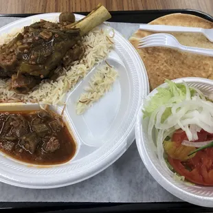 Lamb shank with stewed okra, pita &amp; salad. Ibrahim put a Serrano pepper on my salad!