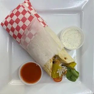 a burrito on a white plate