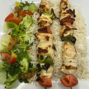 a plate of food with rice and vegetables