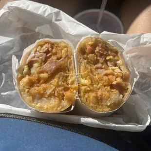 Ham breakfast burrito with hash browns, cheese and salsa