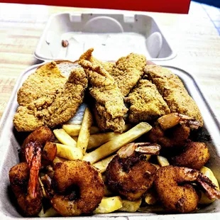 chicken and fries in a styrofoam container