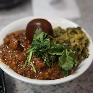 a bowl of chili and vegetables