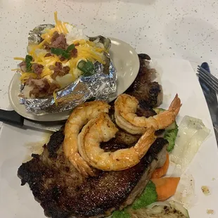 Ribeye with 3 Grilled shrimp and baked potatoe