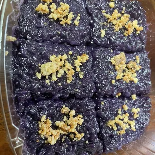 a purple dessert in a plastic container
