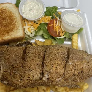 grilled fish, macaroni and cheese, and salad