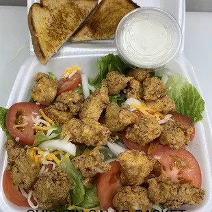 a chicken salad in a styrofoam container