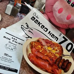 a plate of bacon and eggs