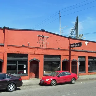 two cars parked in front of it