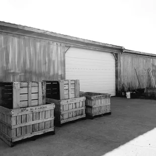 a black and white photo of crates