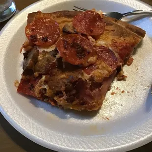 Slice of meat lovers pizza