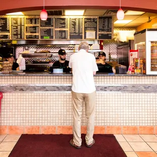 a man standing in front of a counter