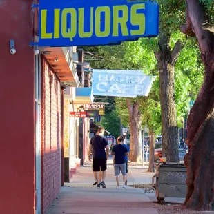 people walking down the sidewalk