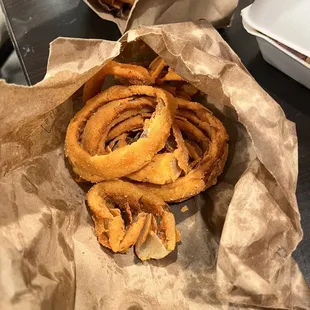 onion rings in a paper bag