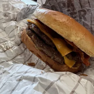 a cheeseburger wrapped in foil