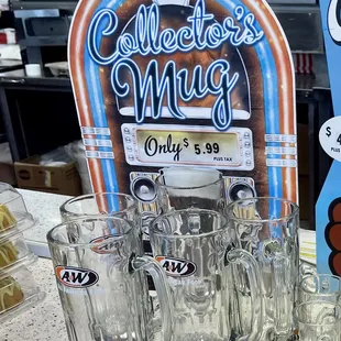 a collection of glasses and a sign