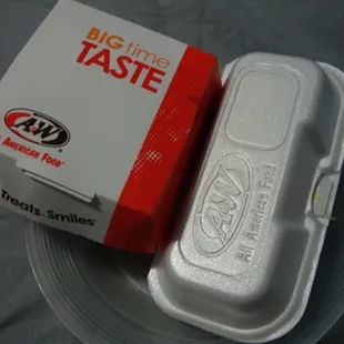 a box of food sitting on a plate