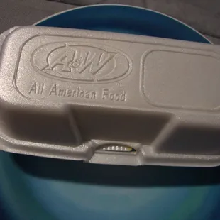a plastic container on a plate