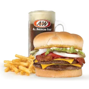 a burger and fries next to a mug of beer