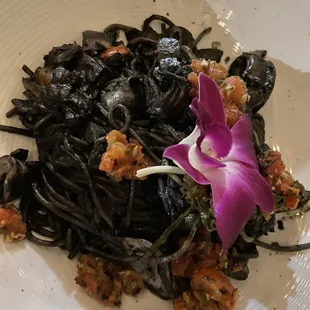 SPAGHETTI AL NERO Squid ink, calamari, spicy calabria peppers, basil and tomato topped with &quot;bottarga&quot;