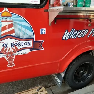 a red truck with a sign on it