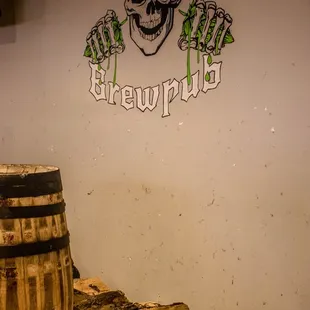 a skull and a barrel of beer