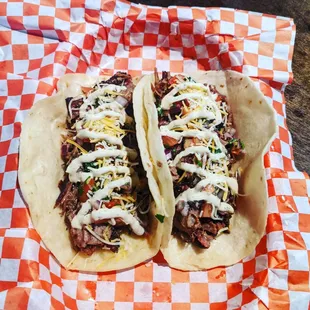 two tacos on a table