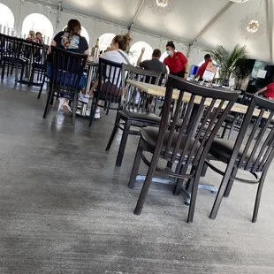 people eating in a tent