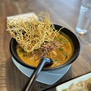 a bowl of soup with noodles