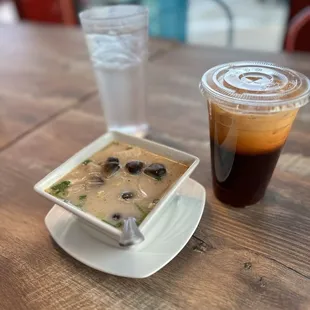 a cup of coffee and a bowl of soup