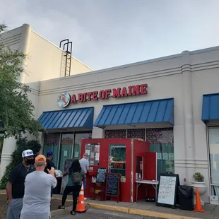 people outside of a restaurant